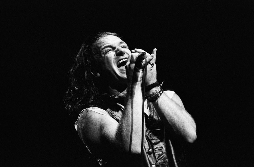 Detail of U2 performing at the NEC 1987 by Reavenall