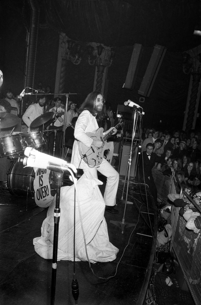 Detail of John Lennon and Yoko Ono on stage at the Lyceum. by Ray Weaver