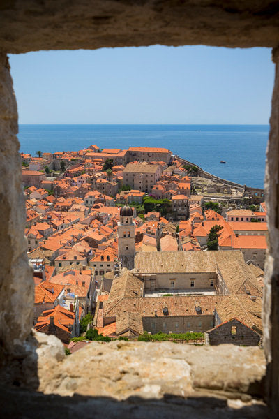 Detail of View over rooftops of the old town from the Minceta Tower, with boats in the Old Port, Dubrovnik, Croatia by Anonymous