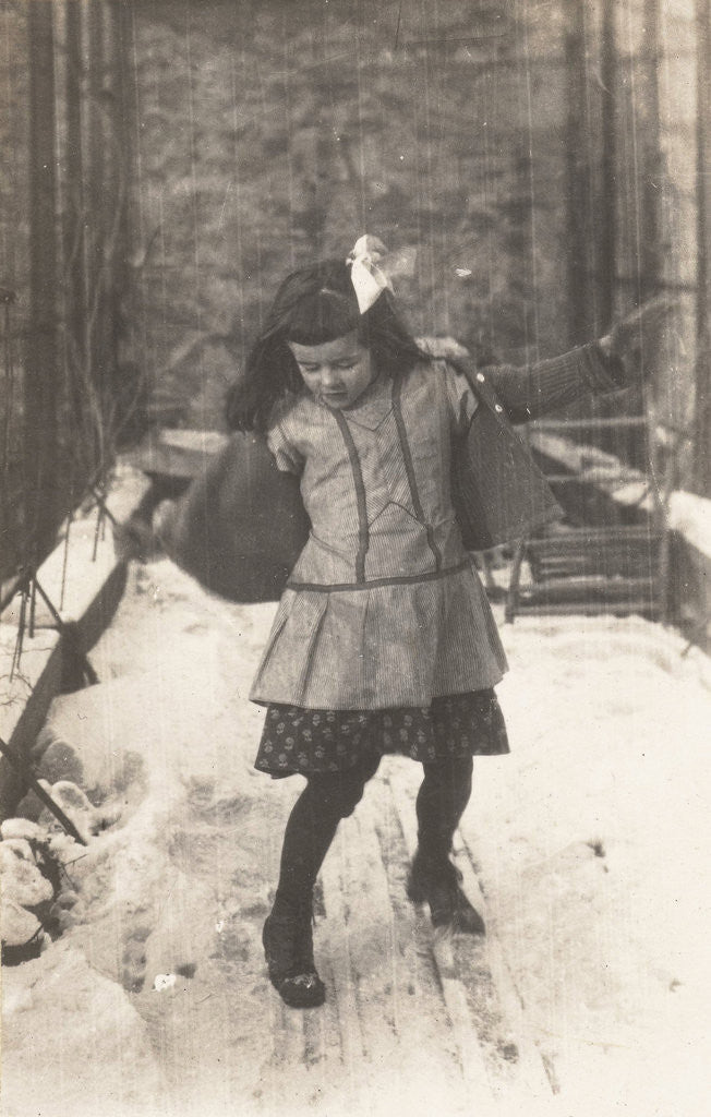 Detail of Marba Titzenthaler, daughter of the photographer, gliding over the snow on the roof terrace of the house Friedrichstrasse, Berlin, Germany by Waldemar Titzenthaler