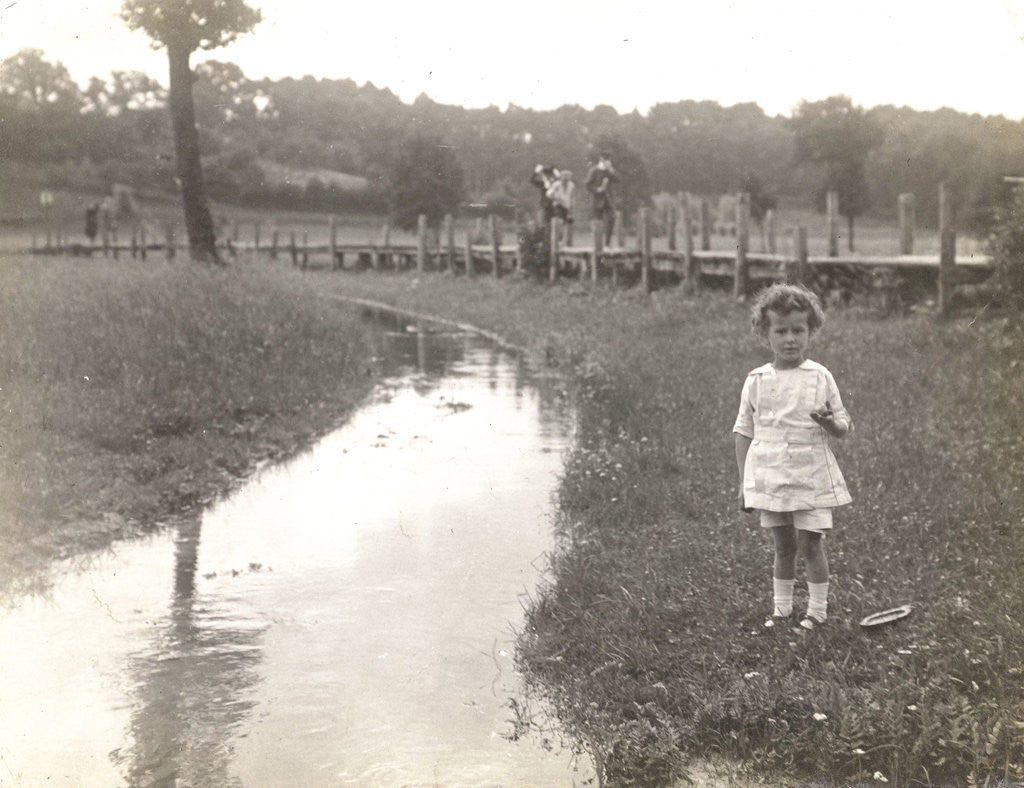 Detail of Eckart Titzenthaler, son of the photographer, standing beside a stream by Waldemar Titzenthaler