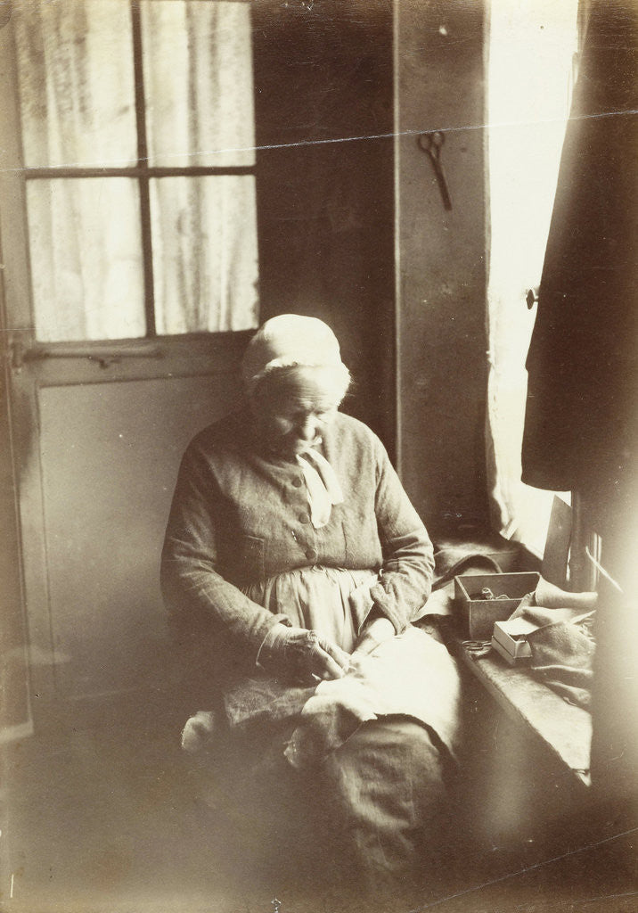 Detail of Old woman sitting by a window sewing by Anonymous