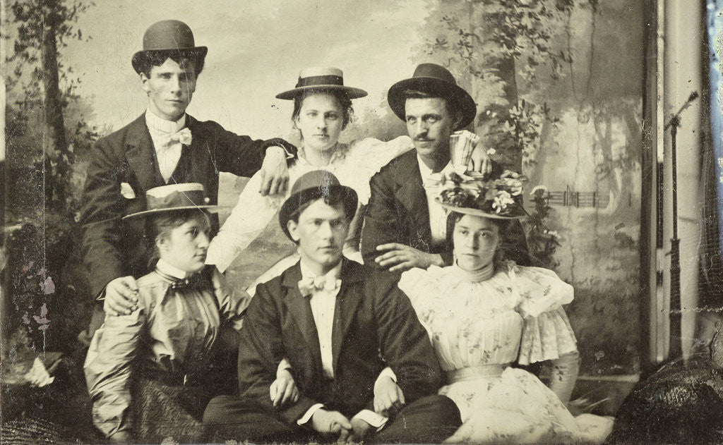 Detail of Group portrait of three men and three women, sitting in a studio with painted cloth background (forest or park scene) by Anonymous