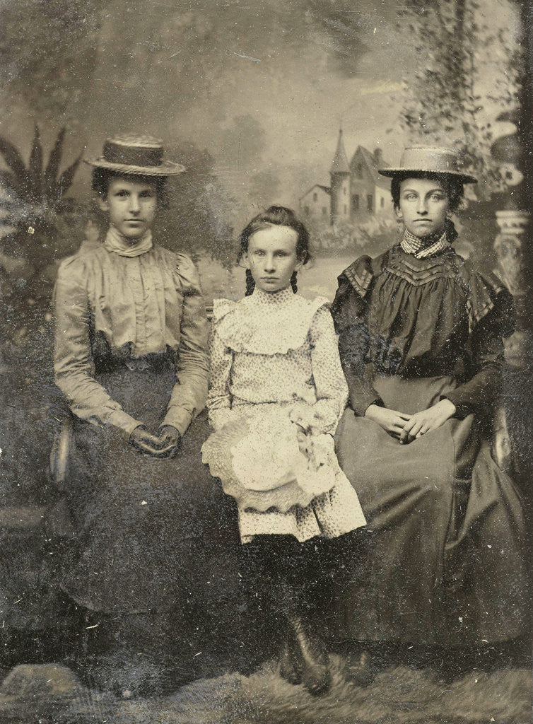 Detail of Portrait of two women and a girl sitting in a studio with painted backdrop by Anonymous