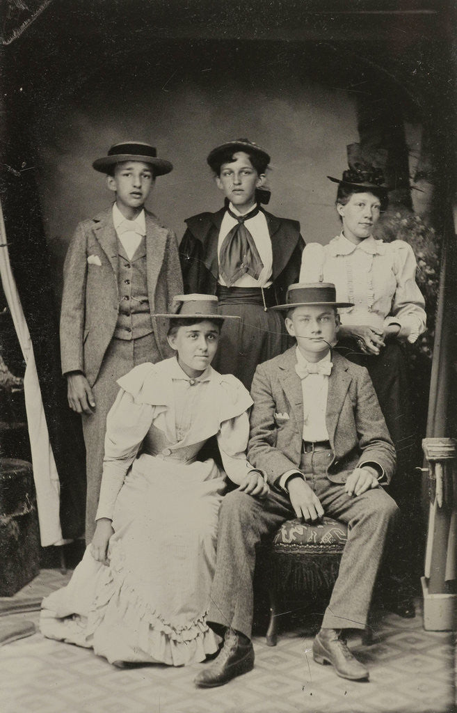 Detail of Group portrait of two men and three women, standing and sitting in a cramped studio by Anonymous