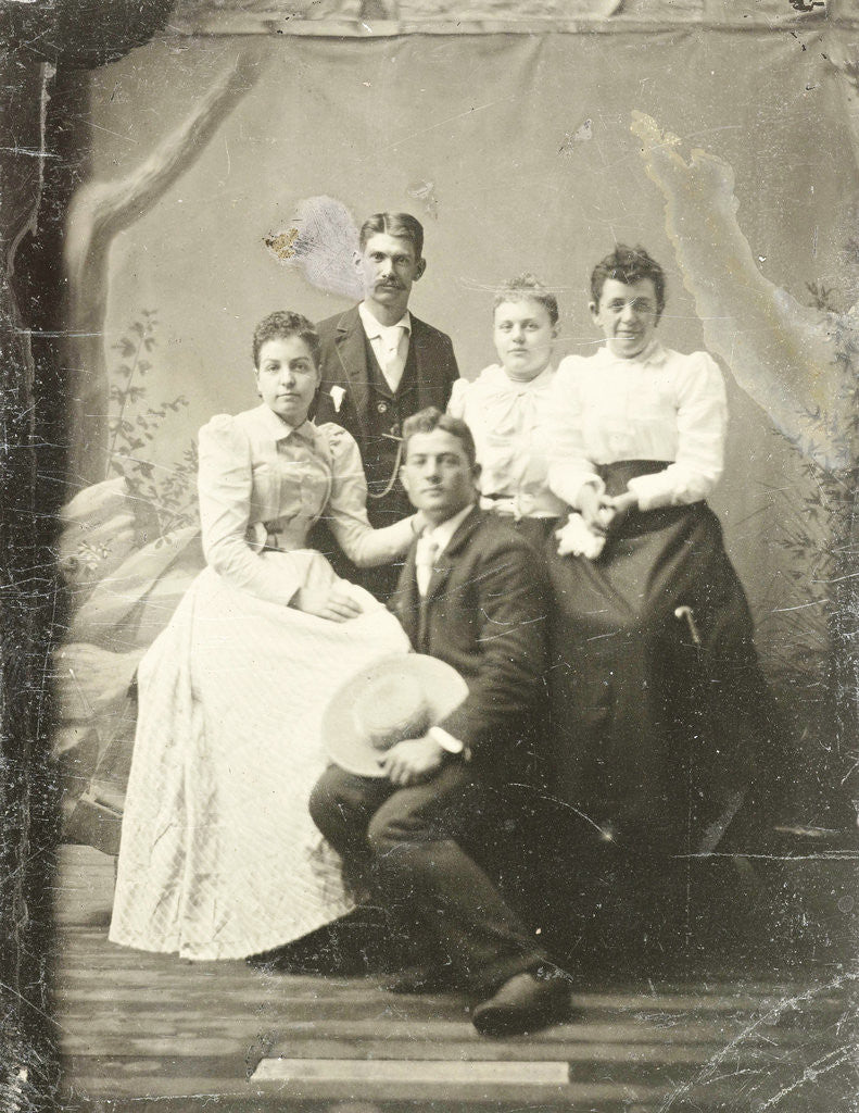 Detail of Group portrait of two men and three women, standing and sitting in front of a painted backdrop, tree, rocks by Anonymous