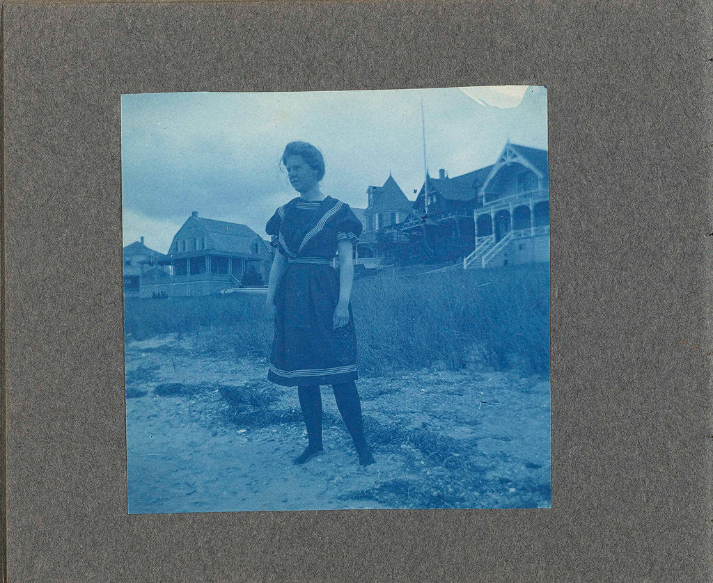 Detail of Woman posing for wooden houses, United States, USA by Anonymous