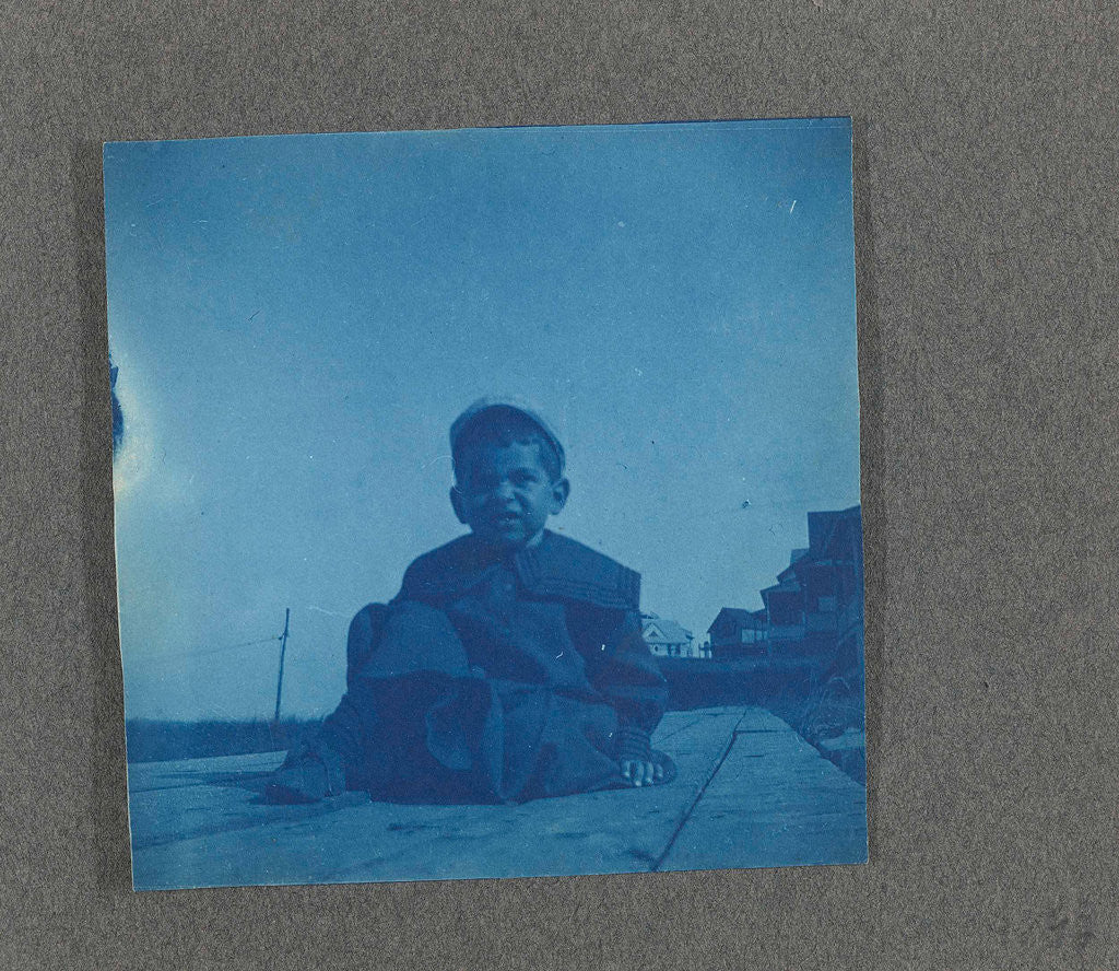 Detail of Boy sitting on wooden planks, USA by Anonymous