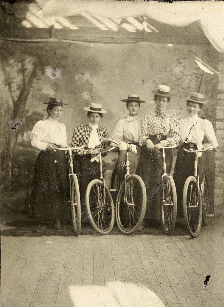 Detail of Group portrait of five women with bikes for a painted backdrop with forest by Anonymous