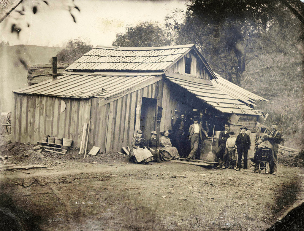 Detail of View of a wooden house with ten people, one of whom cut and / or shaved by Anonymous
