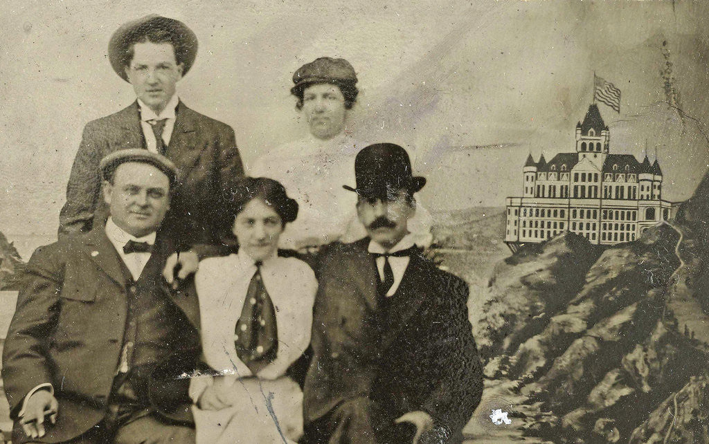 Detail of Group portrait of three men and two women in front of a painted backdrop with Cliff House in San Francisco by Anonymous