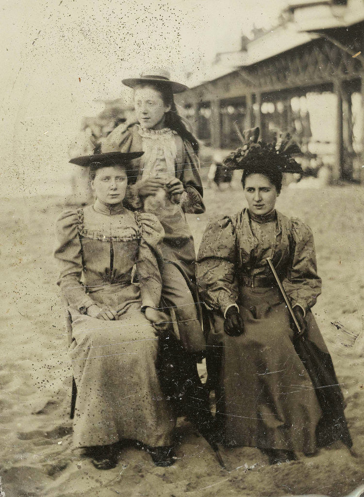 Detail of Three women on the beach, with a pier as background by Anonymous