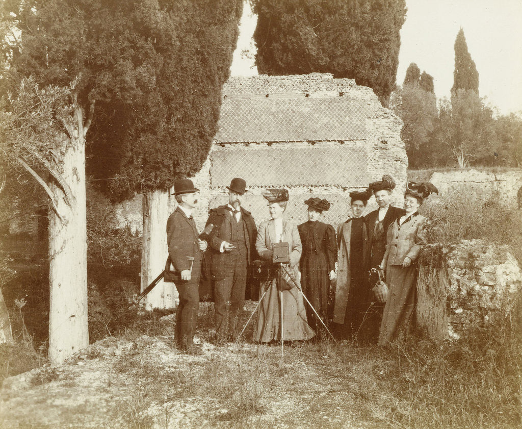 Detail of Group portrait of five women (one of whom is behind a camera) and two men for a ruin in Italy or France by Anonymous