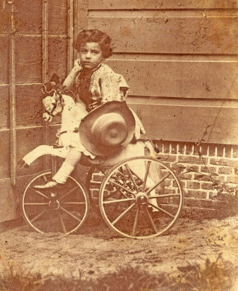 Detail of Louis Asser, son of the photographer, on a tricycle by Eduard Isaac Asser