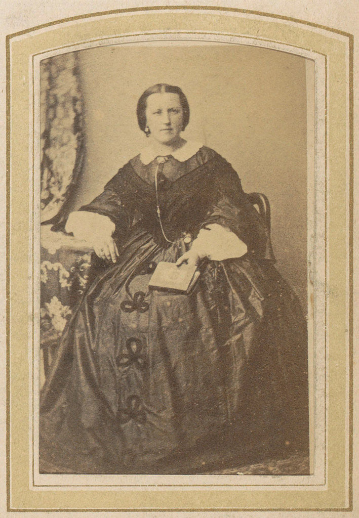 Detail of Portrait of a seated woman in a dress with a book in hand by London and Continental Photographic Copying Company