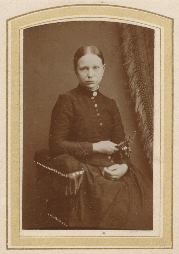Detail of Portrait of a seated woman in a long dress with a twig in hand by H. Bulens Jr