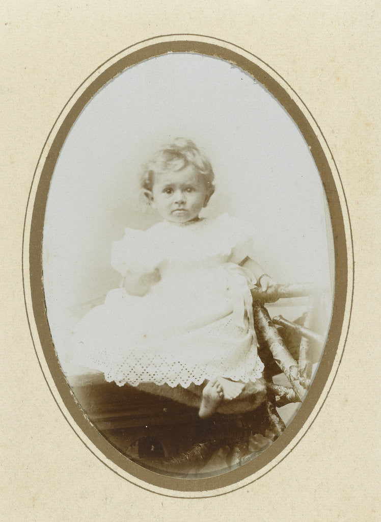 Detail of Portrait kindergarten crochet dress sitting on rustic fence by Th.F. v.d. Pol