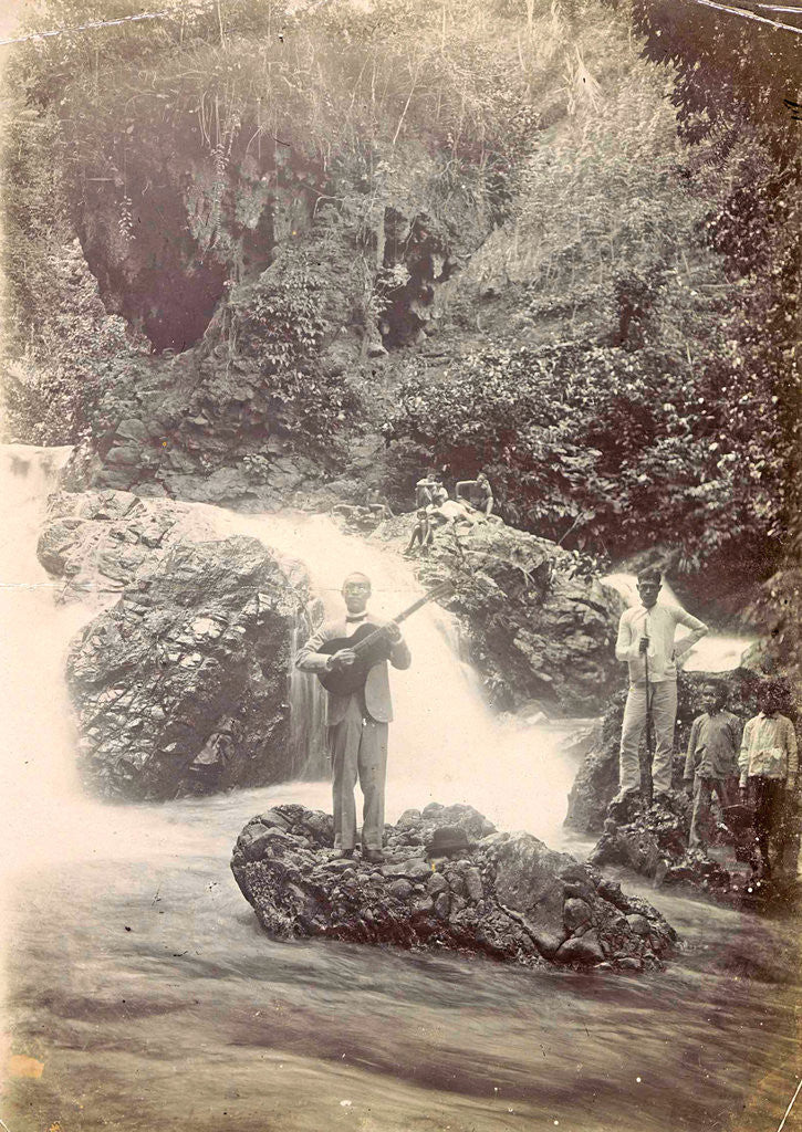 Detail of Guitar playing man at a waterfall at Batu Gantong in Ambon, Indonesia by Anonymous