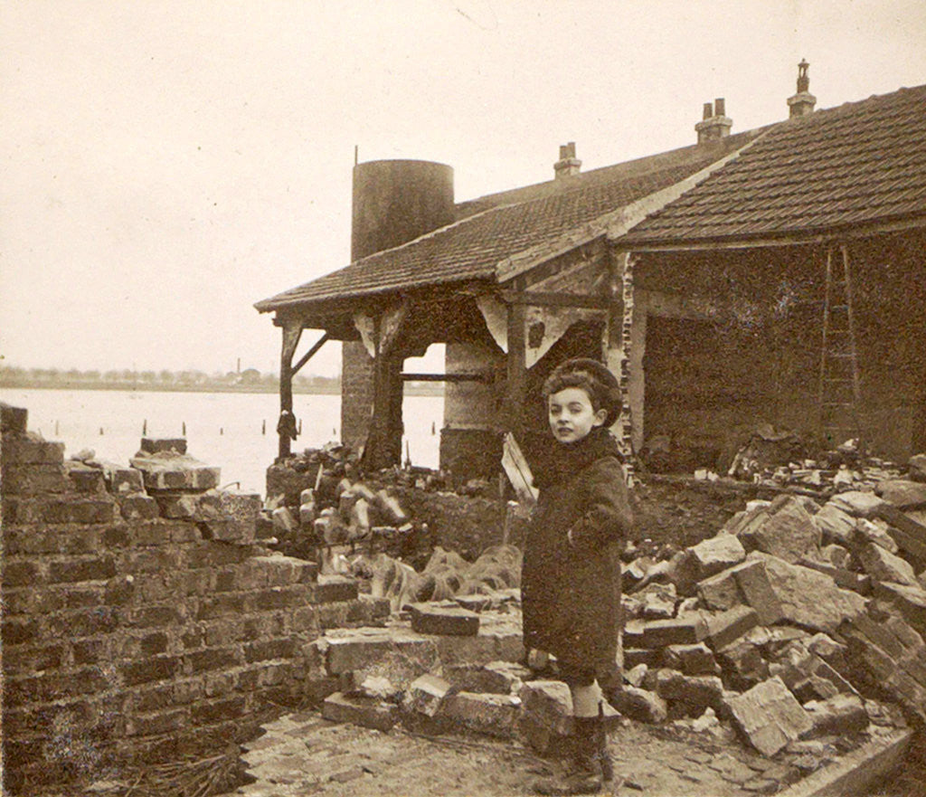 Detail of Child at a destroyed building in a flooded suburb of Paris by Anonymous