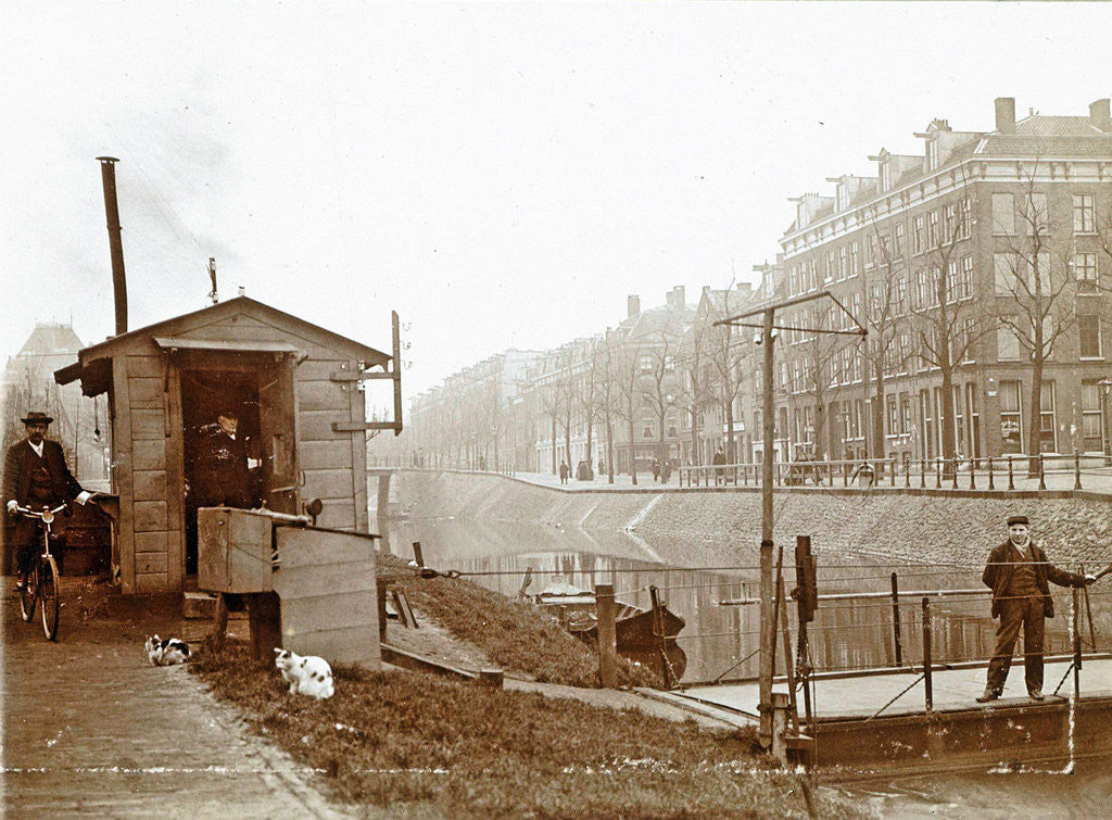 Detail of Men, presumably workers, and two cats at a jetty and a guardhouse along a canal by Anonymous