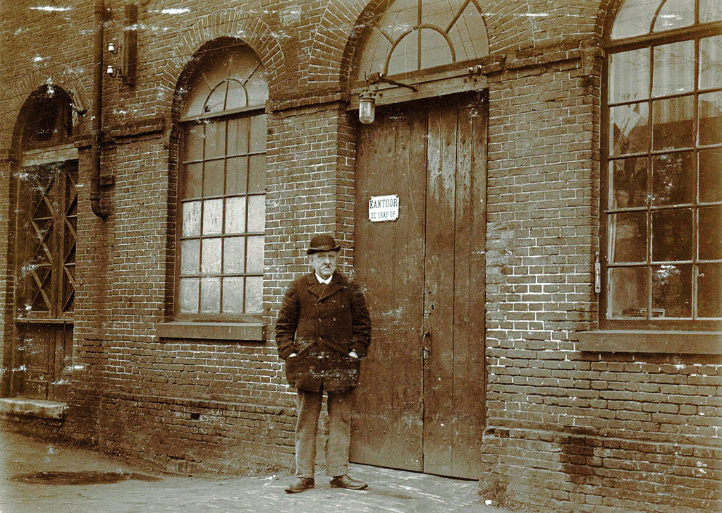 Detail of Man standing in front of an office door by Anonymous