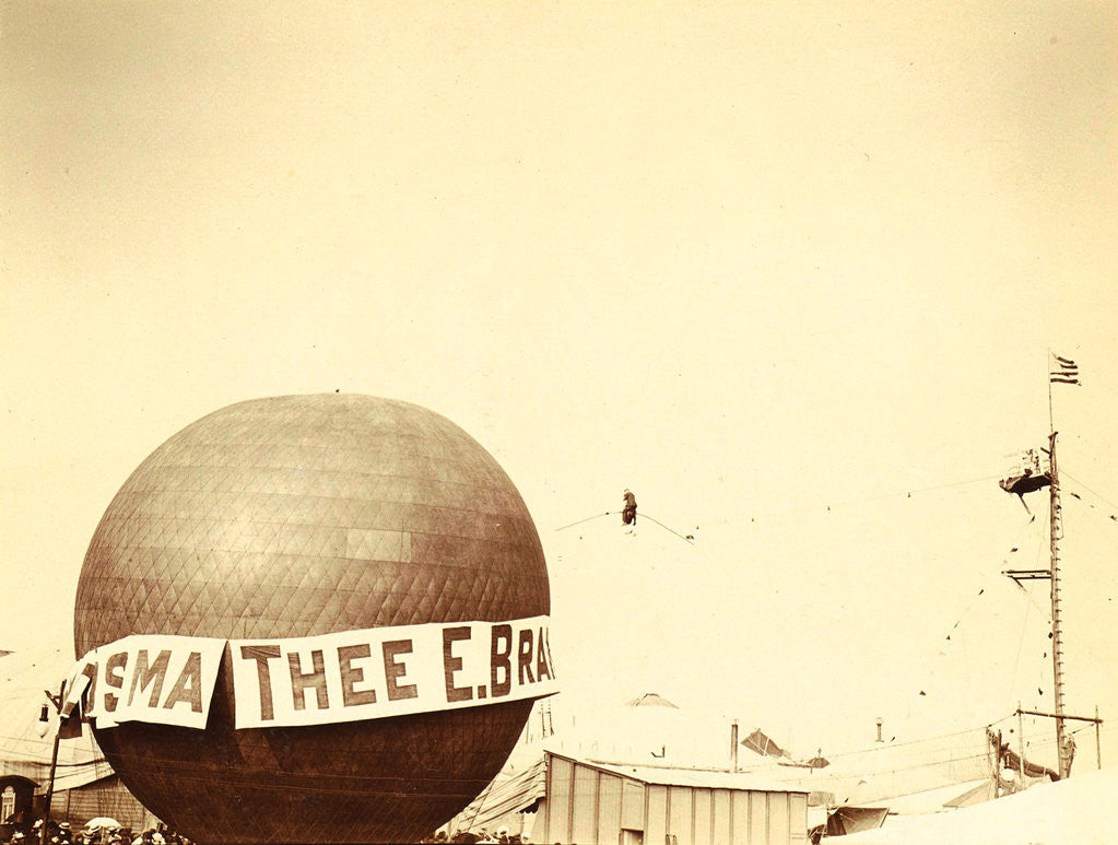 Detail of Hot air balloon with advertisements for Tea E Brandsma in the background a tightrope walker over a fairground by Anonymous