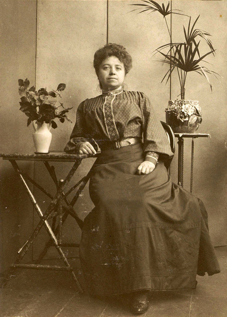 Detail of Woman sitting at tables with plants and flowers by Anonymous