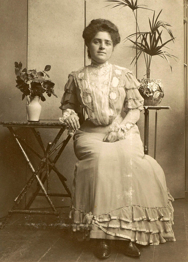 Detail of Woman sitting at tables with plants and flowers by Anonymous
