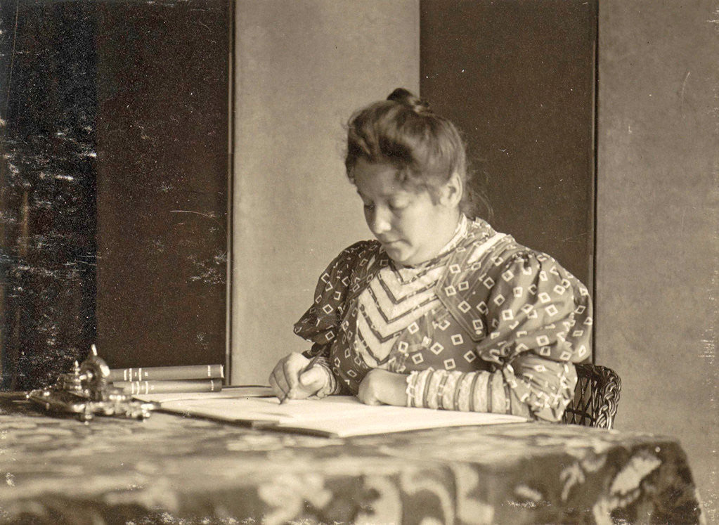 Detail of woman writing at a table by Anonymous