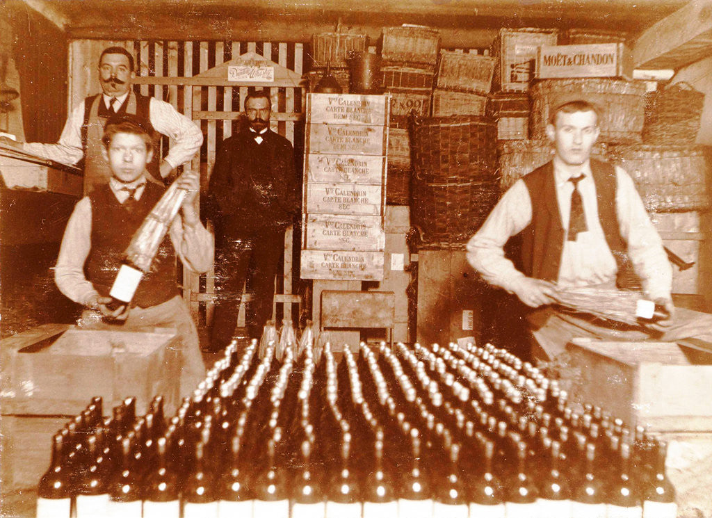 Detail of Men packaged bottled beverage bottles in crates by Anonymous