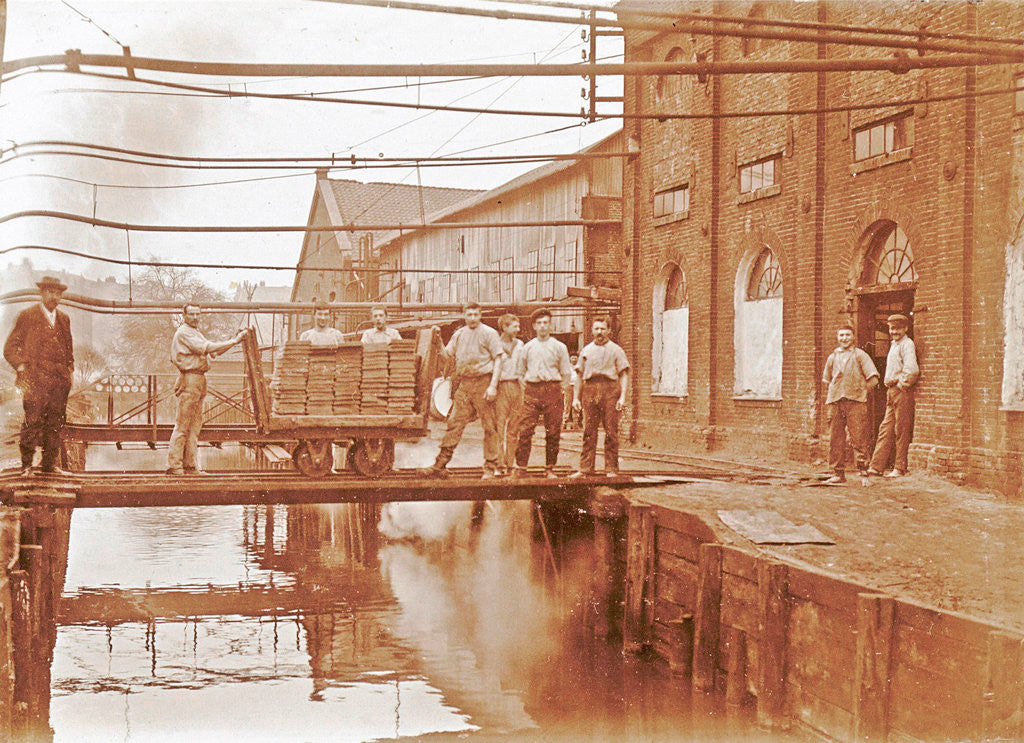 Detail of Workers in the back with a loaded cart at a pond by Anonymous