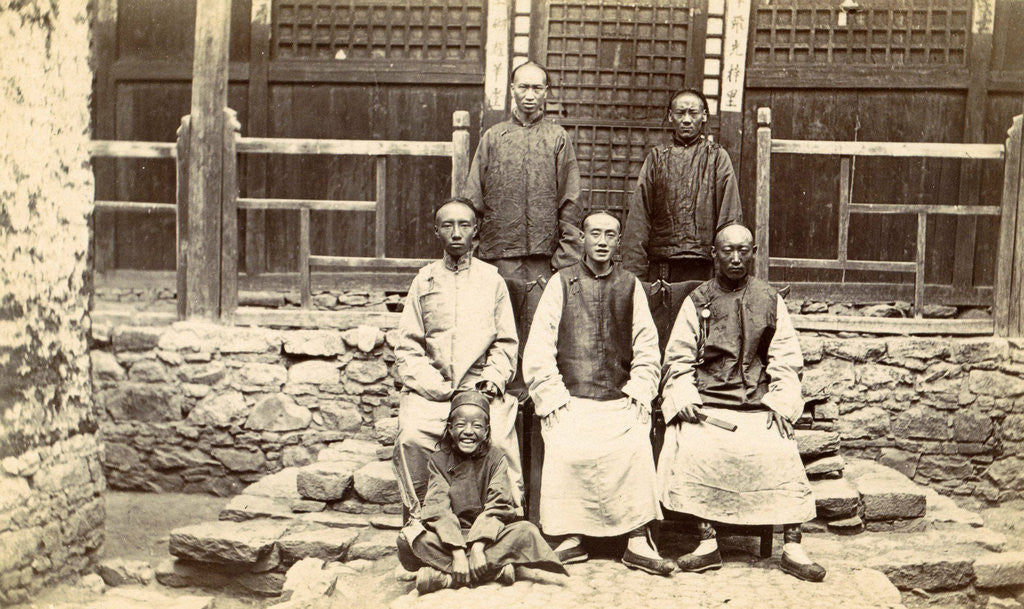 Detail of Chinese men and a boy near a house in Tibet by D.T. Dalton