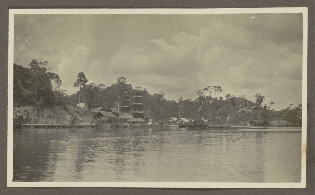 Detail of Bank of a village with derricks and buildings seen from the water by Anonymous