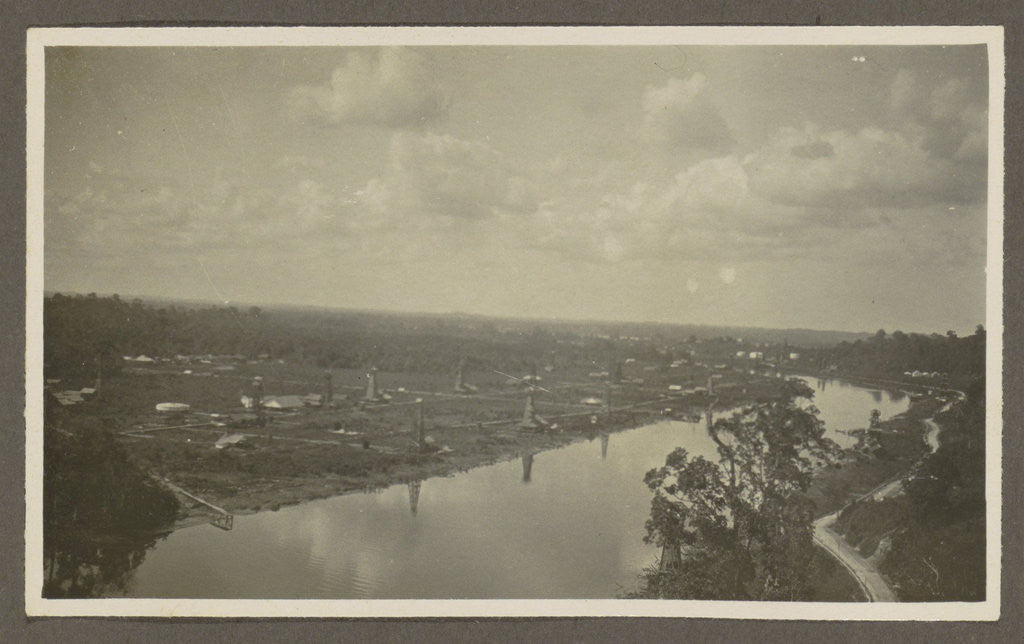 Detail of Panorama of a river, drilling rigs, storage tanks and buildings by Anonymous