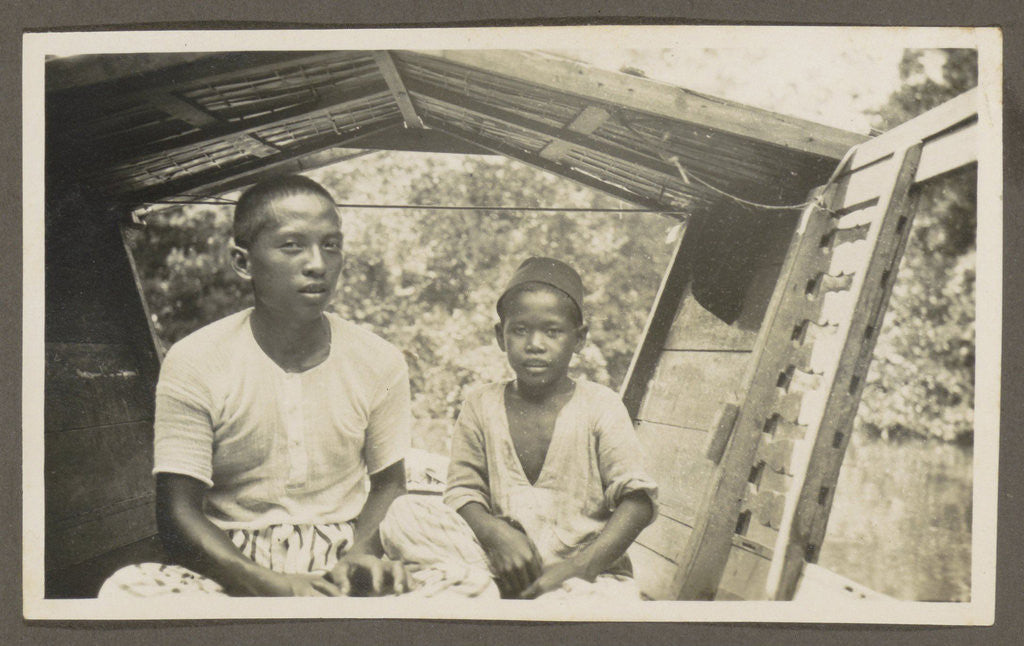 Detail of Two Indian boys sitting in roofed wooden boat by Anonymous