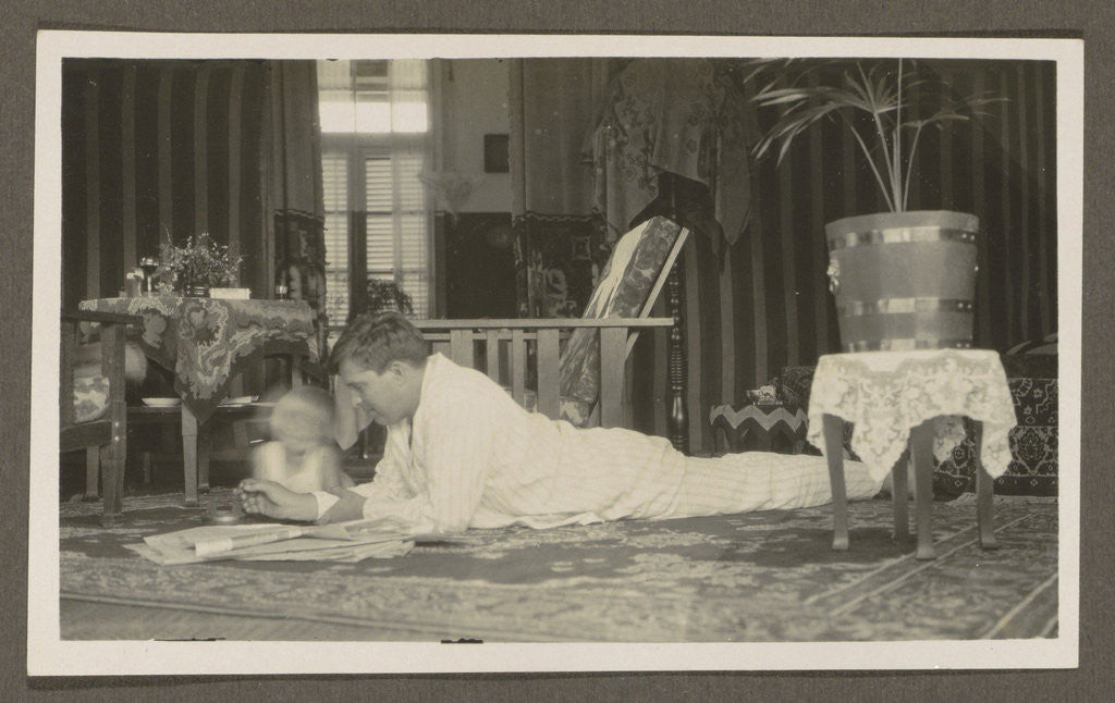 Detail of Man and a child lying on a carpet by Anonymous