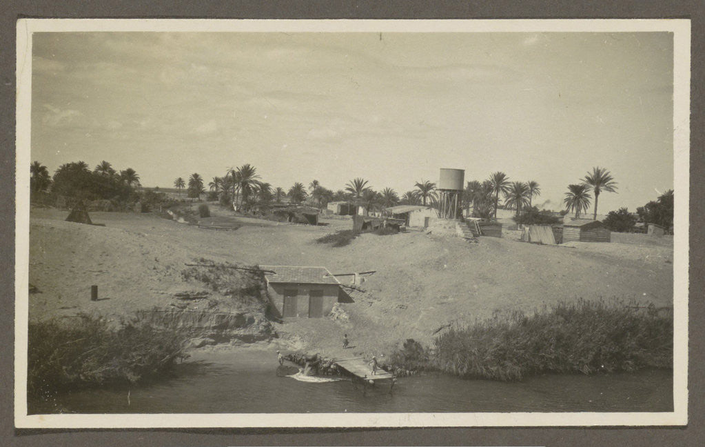 Detail of View of a village with a water pool and palm trees on a shore by Anonymous