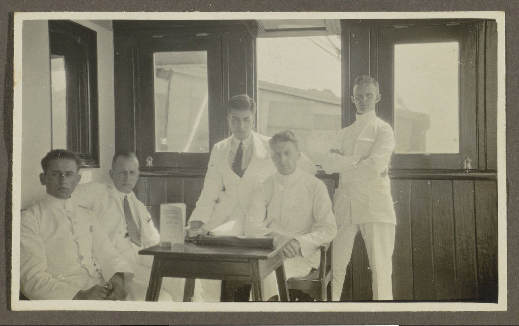 Detail of Five men in tropical attire sitting around a table by Anonymous
