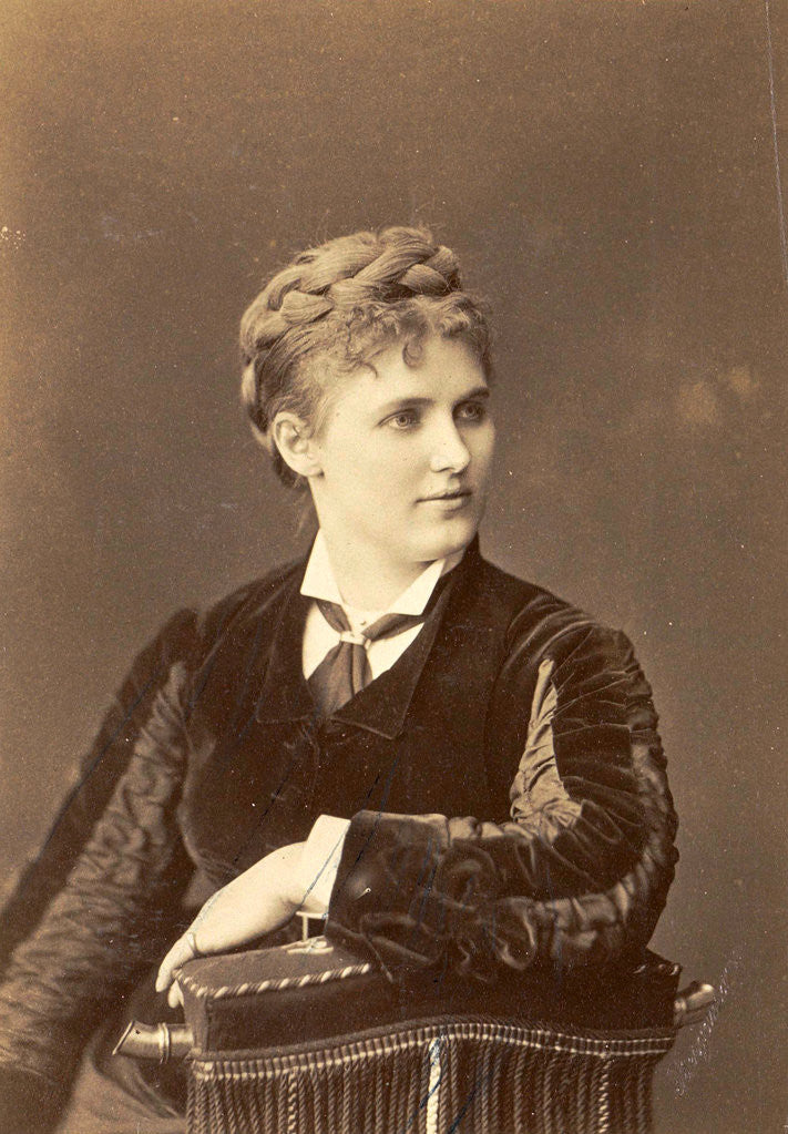 Detail of Studio Portrait of a woman sitting on a chair with curved back by Anonymous