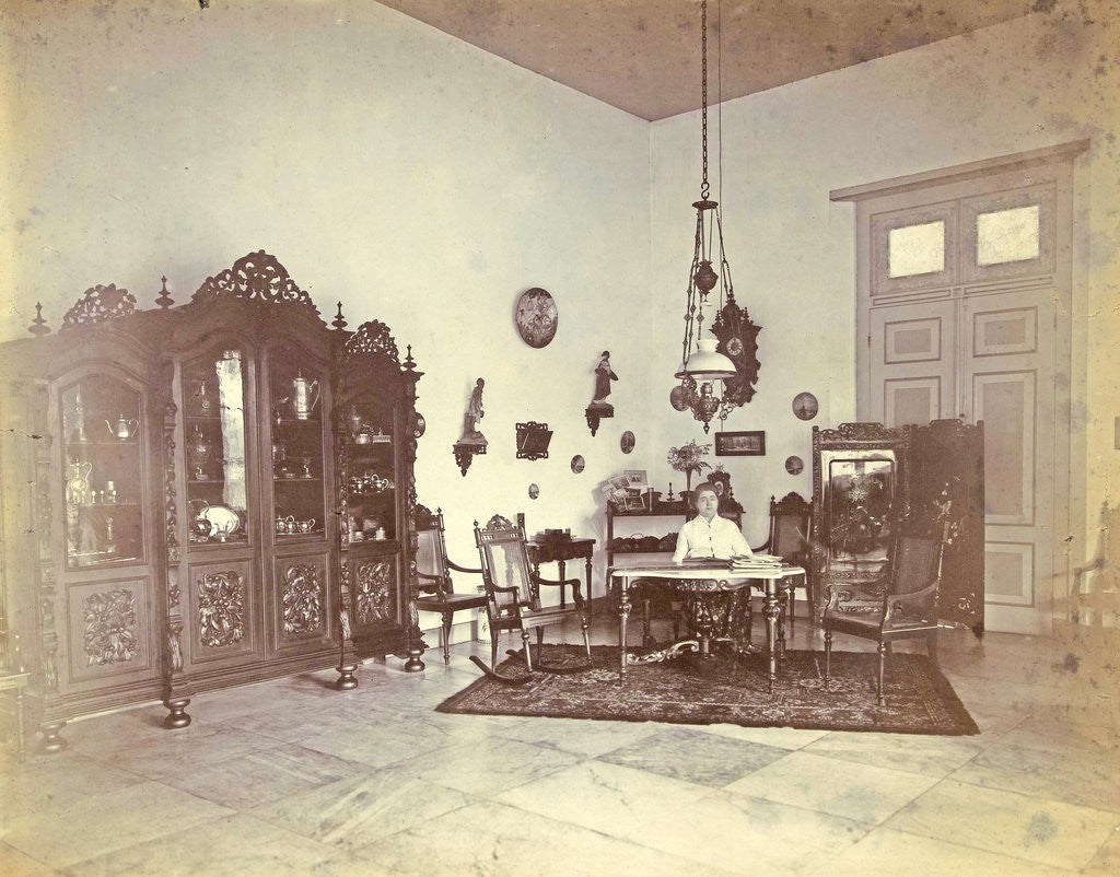 Detail of Portrait of a woman in a living room with colonial décor in Indonesia by Anonymous