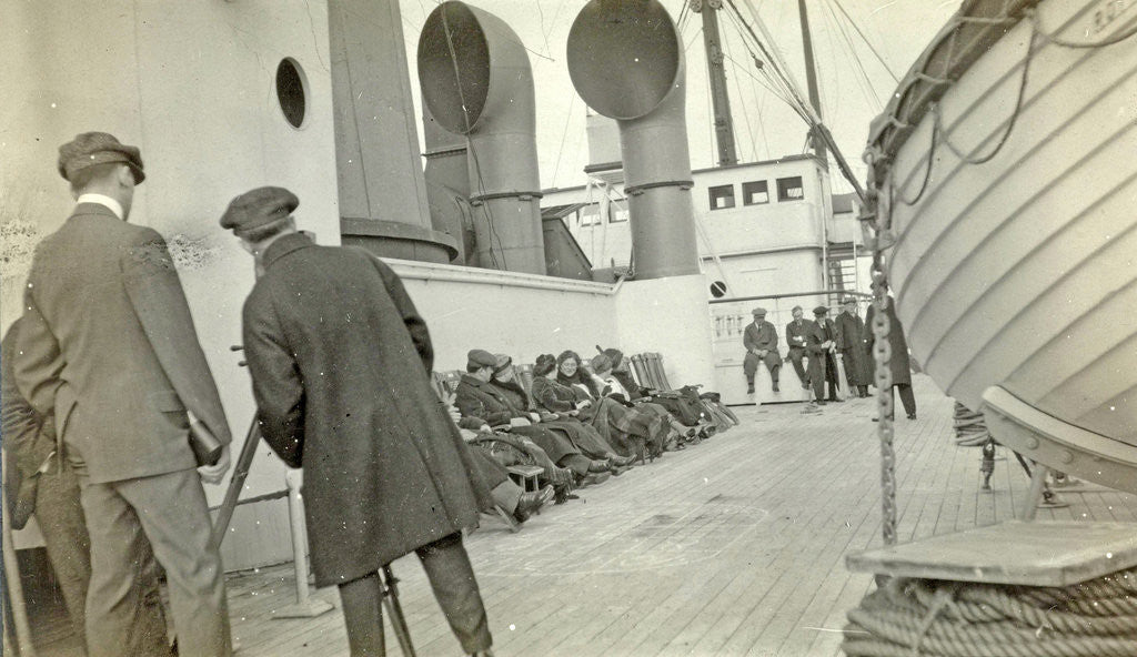 Detail of Aboard ship to New York in World War I, filmmaker among the guests on deck filming by Anonymous