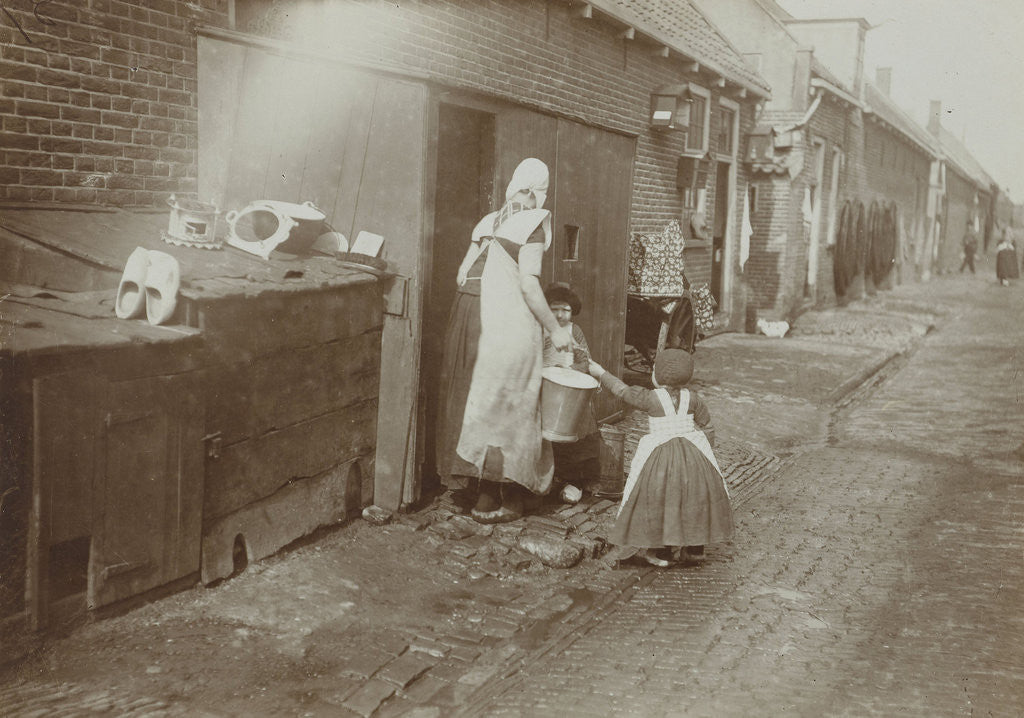 Detail of Mother and children in costume on the streets of Spakenburg by Anonymous