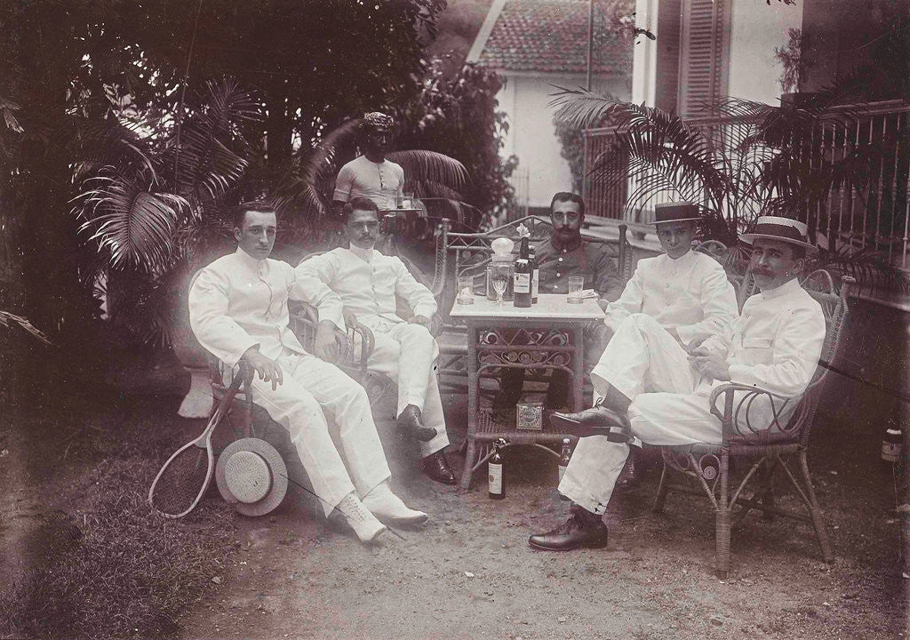 Detail of Group of men at the table in front of the porch is verved by Indian man by Anonymous