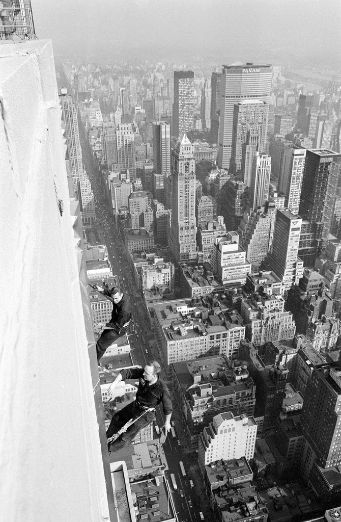 Detail of Workmen busy cleaning windows 1000 ft up the Empire State building by Daily Herald