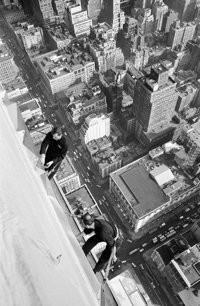 Detail of Workmen busy cleaning windows 1000 ft up the Empire State building by Daily Herald