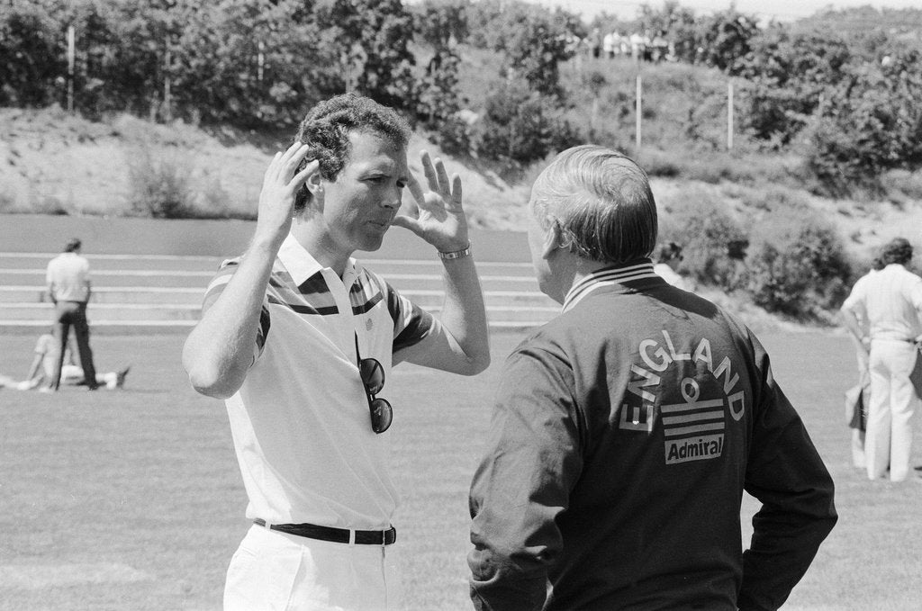 Detail of England manager Ron Greenwood talks to Franz Beckenbauer, 1982 World Cup Finals in Spain by Monte Fresco