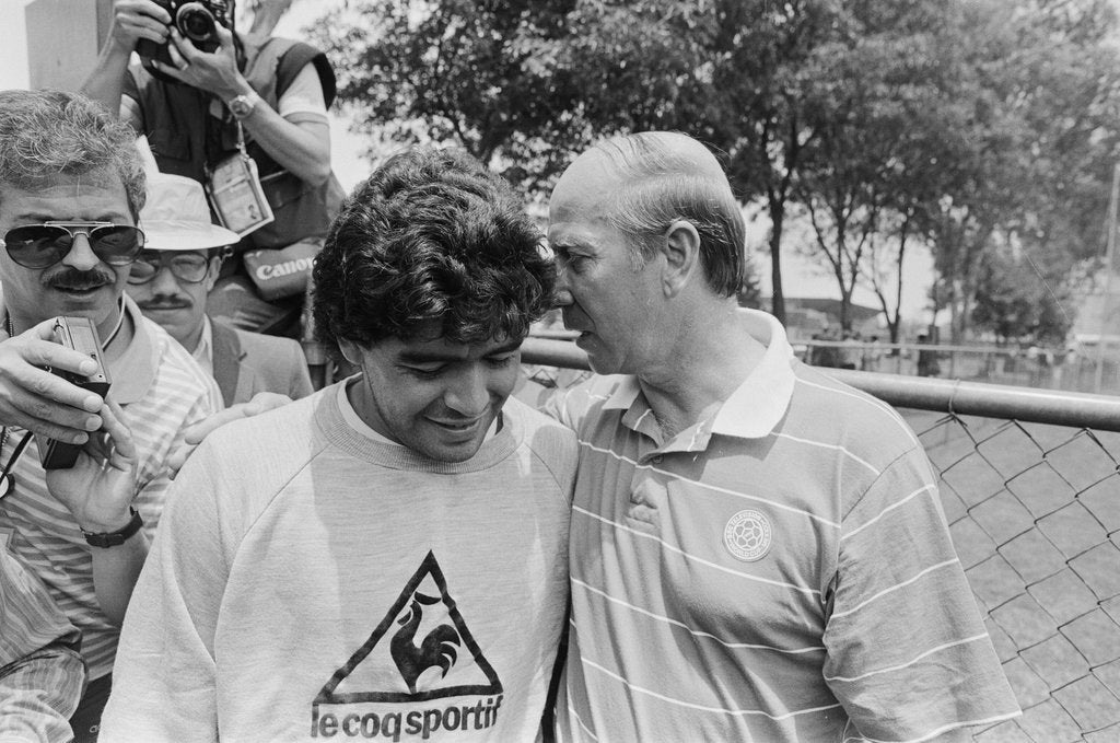 Detail of Argentina footballer Diego Maradona speaks to former England footballer Bobby Charlton, 1986 World Cup Finals in Mexico by Monte Fresco