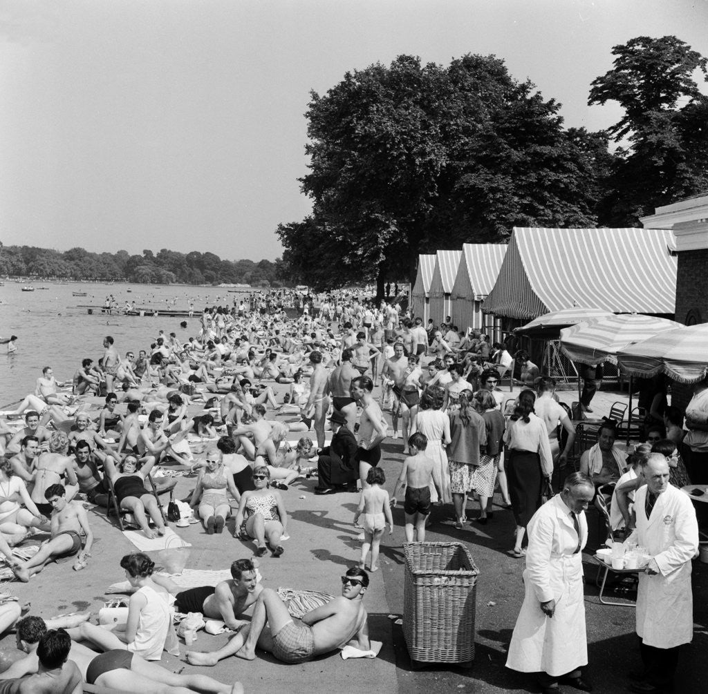 Detail of People sunbathing in a heatwave at the Serpentine Lido by Tommy Lea