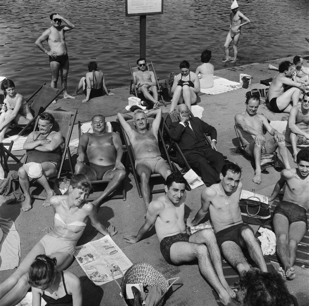 Detail of People sunbathing in a heatwave at the Serpentine Lido by Tommy Lea