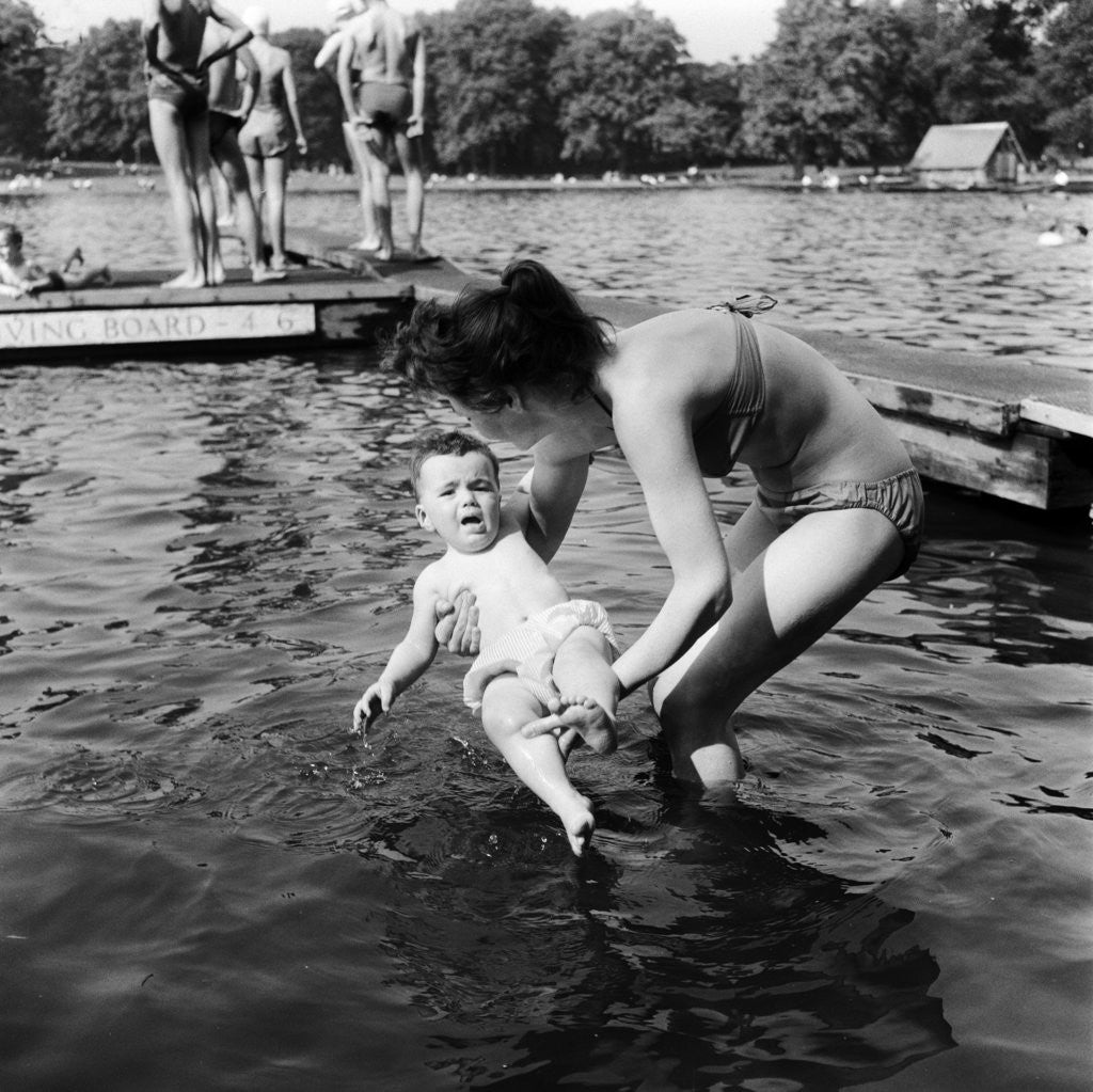 Detail of People sunbathing in a heatwave at the Serpentine Lido by Tommy Lea